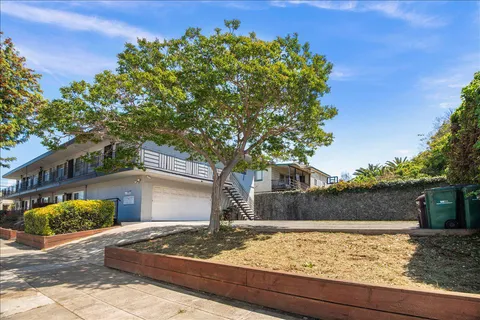 a view of a backyard of the house