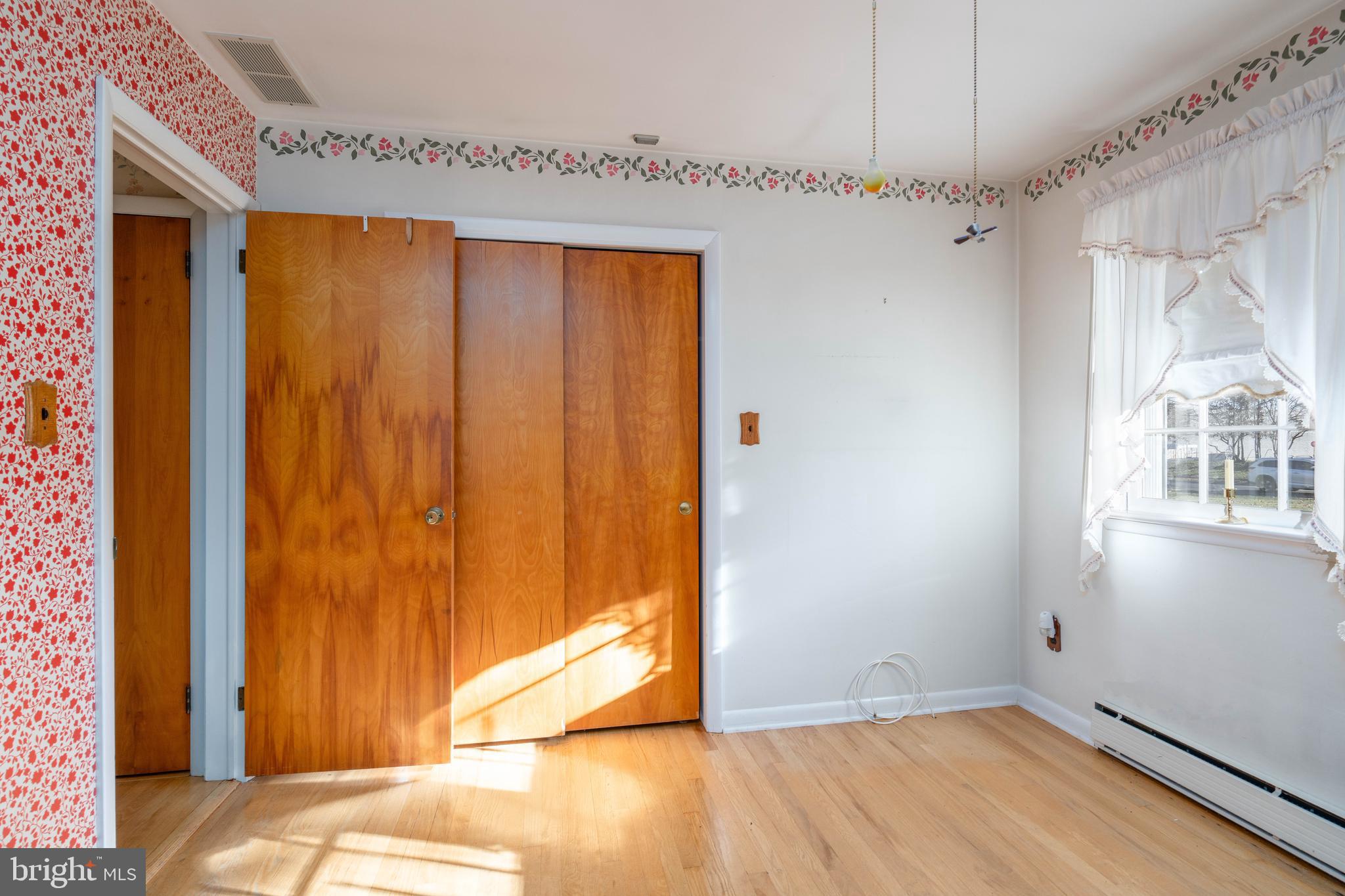 19 Middle Road Hammonton, NJ 08037 - Photo 21 of 52 a view of a room with wooden floor and windows