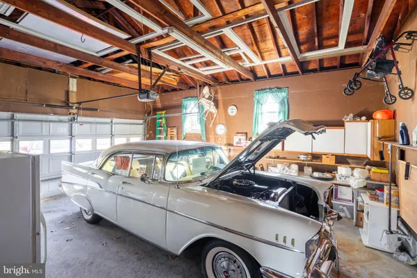 a view of parking garage with cars parked