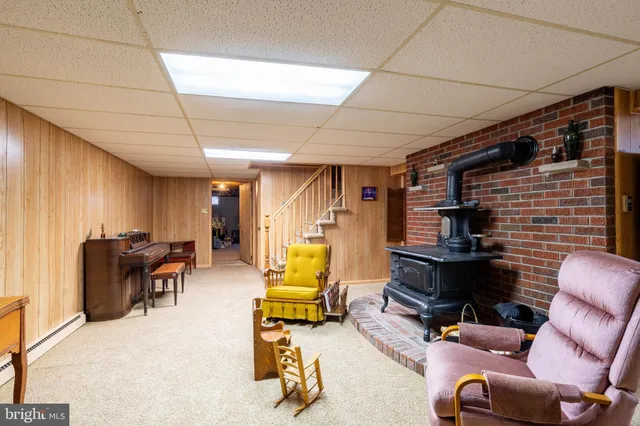 a living room with furniture windows and a fireplace