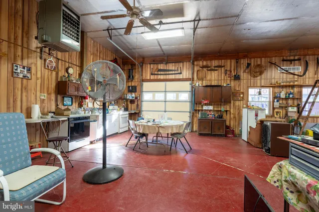 a living room with lots of furniture and a chandelier