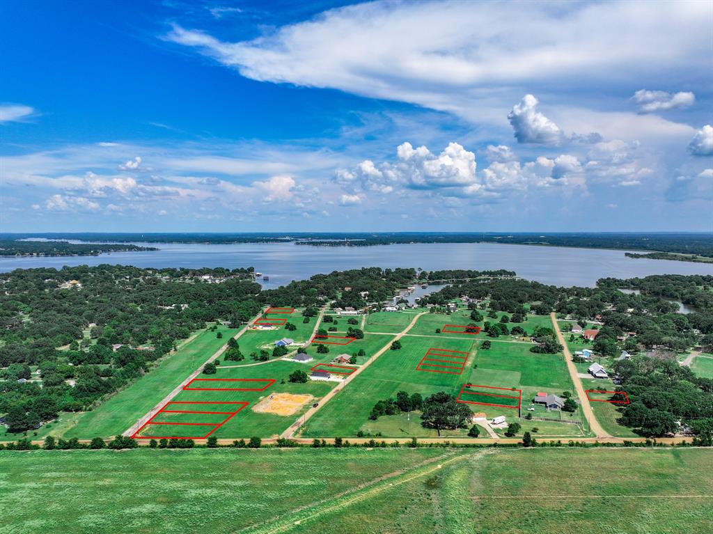 Tbd3 Cedar Elm Road Trinidad, TX 75163 - Photo 8 of 8 a view of a big yard with a swimming pool and outdoor seating