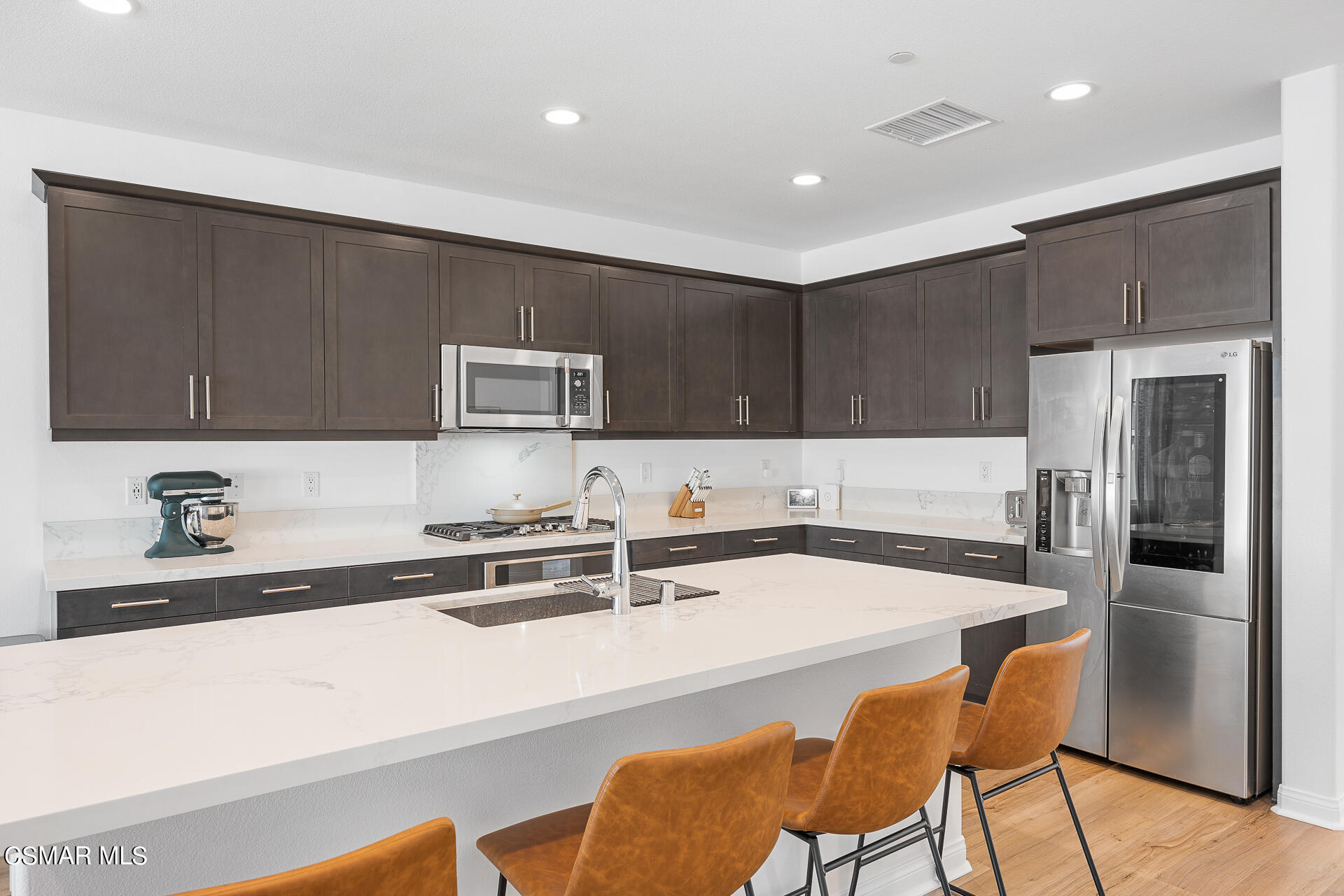 369 Rose Street Fillmore, CA 93015 - Photo 12 of 52 a kitchen with stainless steel appliances a sink a stove a refrigerator and cabinets