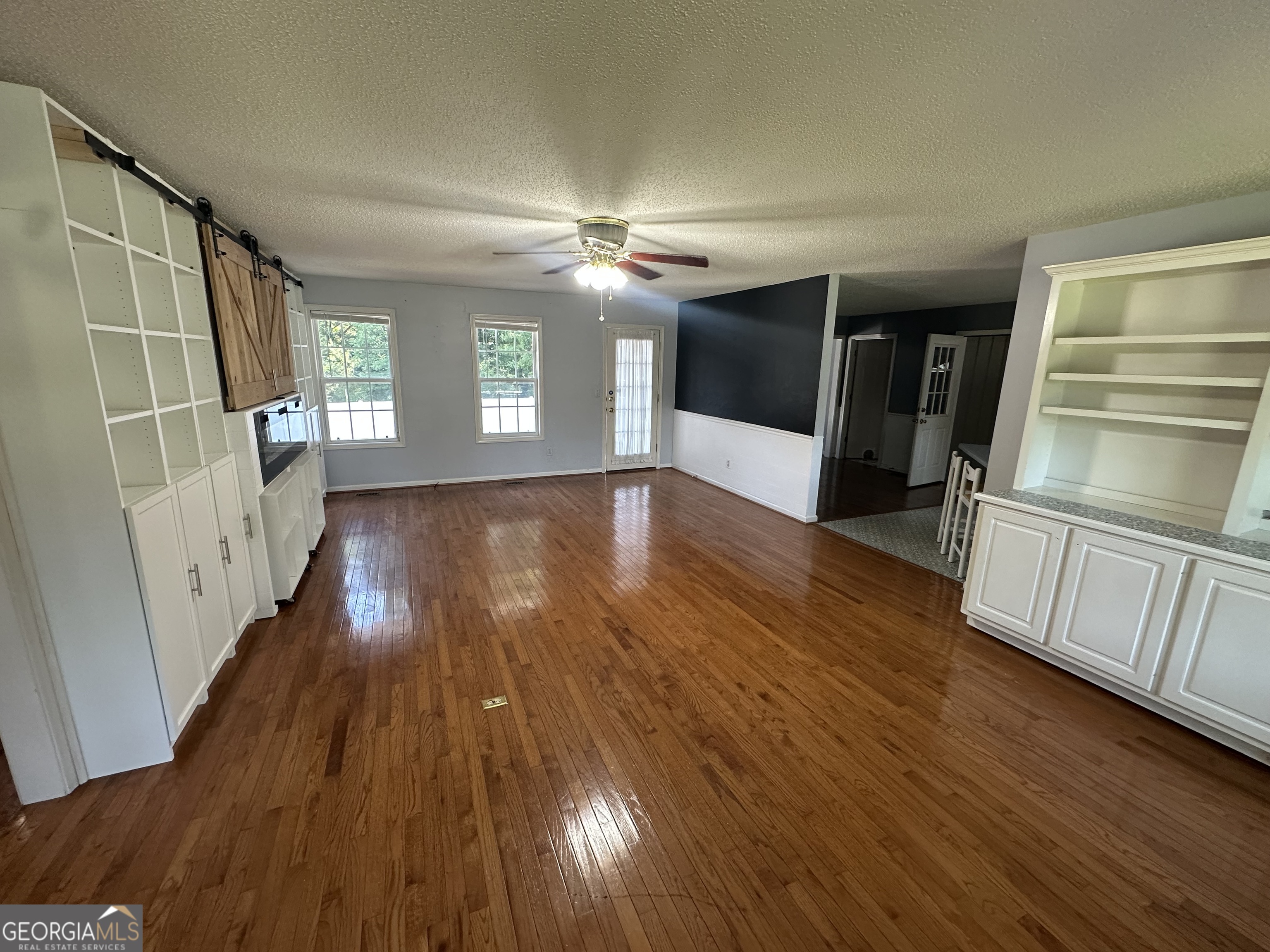 384 Sam Brown Boulevard Commerce, GA 30529 - Photo 3 of 25 a view of empty room with wooden floor