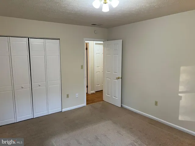 wooden floor and closet in a room