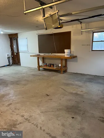 a view of a livingroom with furniture and a flat screen tv