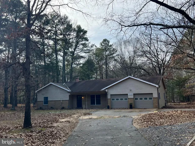 a house with a tree in front of it