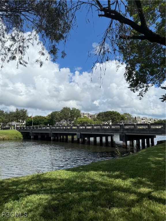 7925 Southwest 86th Street Miami, FL 33143 - Photo 12 of 12 a view of a lake with a mountain in the background