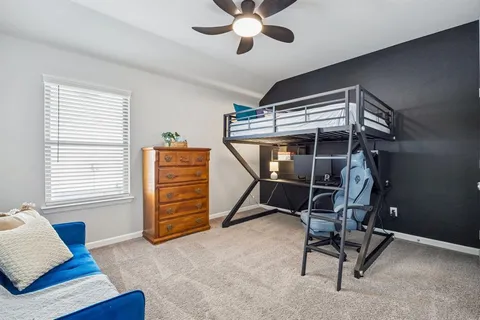 a view of room with window and furniture