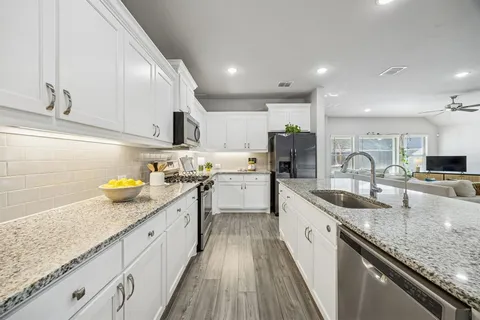 a kitchen with granite countertop lots of counter top space