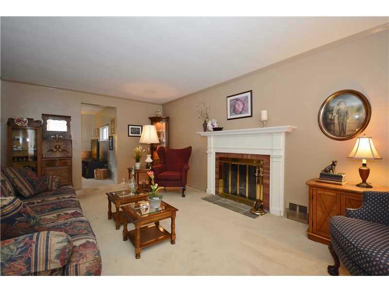 5397 Highgrove Road Whitehall, PA 15236 - Photo 3 of 25 Living Room. Large living room with gas log fireplace.