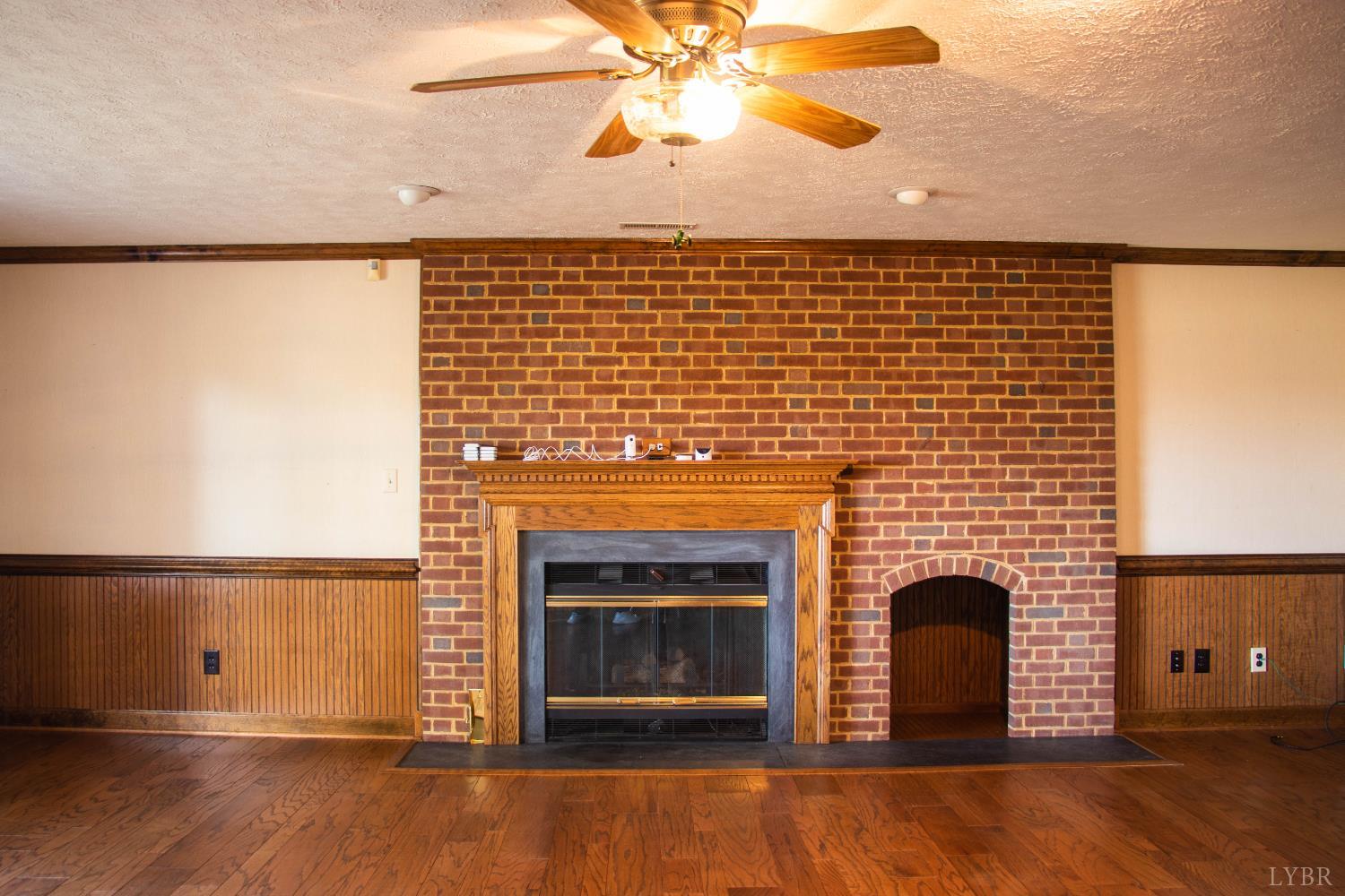 7941 Sugar Hill Road Brookneal, VA 24528 - Photo 12 of 76 a living room with a fireplace