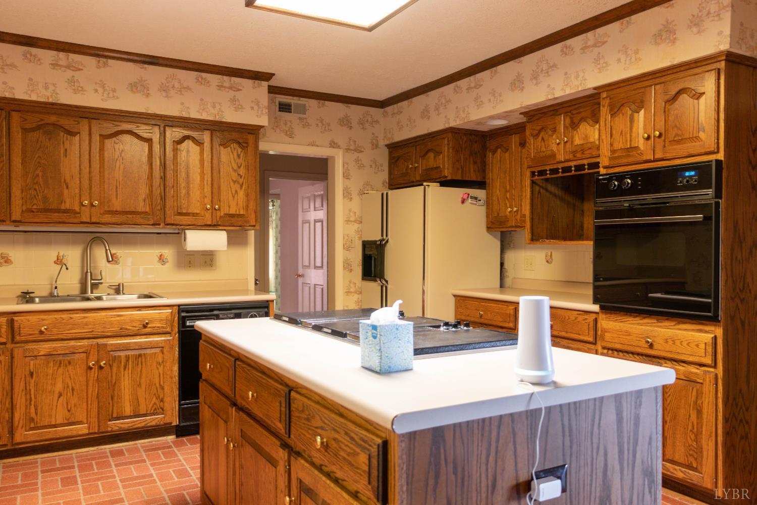 7941 Sugar Hill Road Brookneal, VA 24528 - Photo 15 of 76 a kitchen with stainless steel appliances a sink and a refrigerator