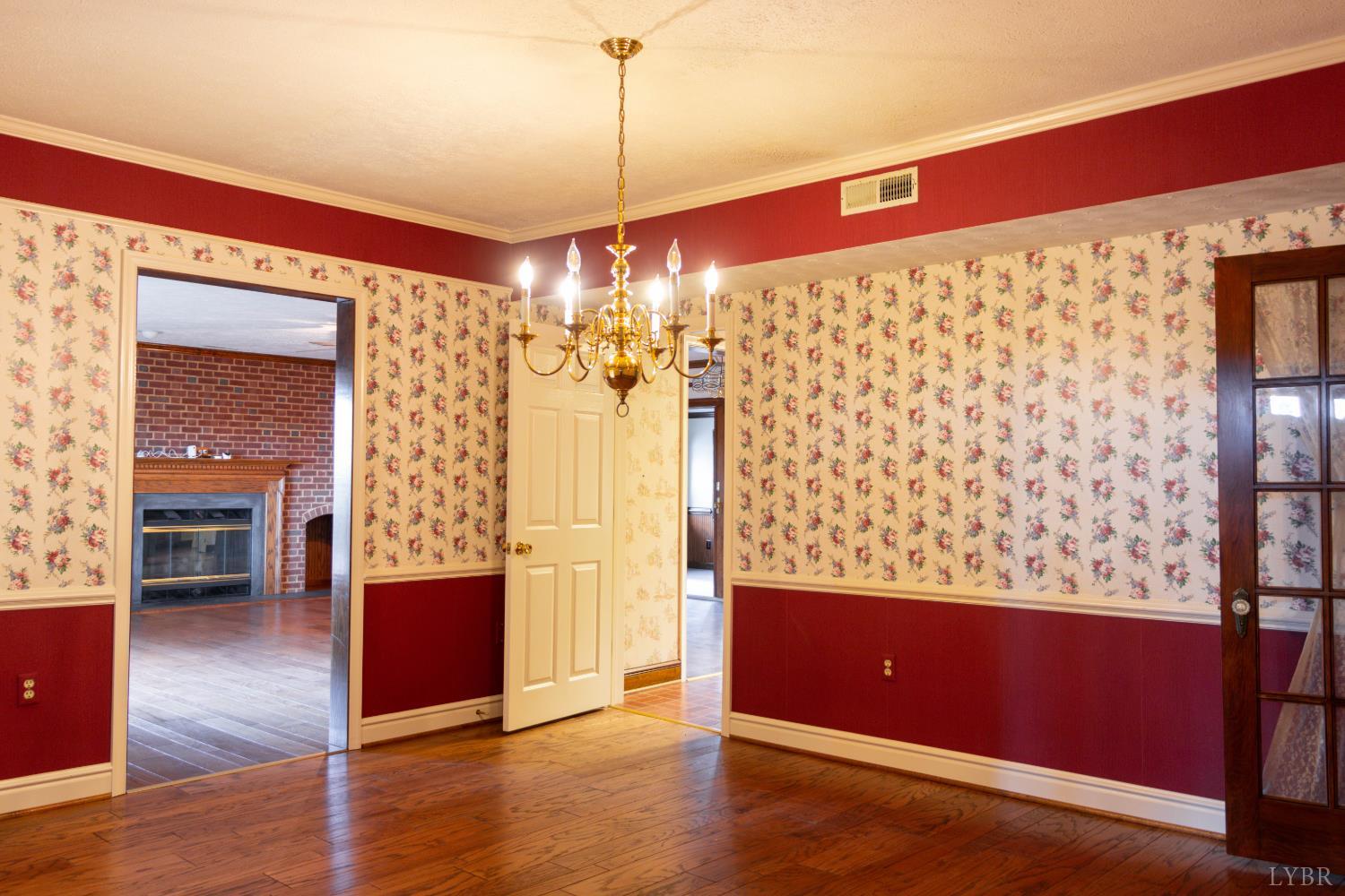 7941 Sugar Hill Road Brookneal, VA 24528 - Photo 19 of 76 a view of a living room with furniture and chandelier