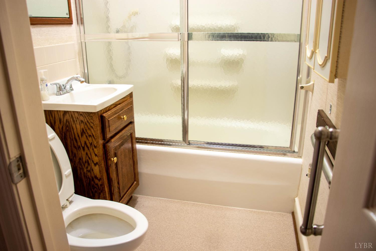 7941 Sugar Hill Road Brookneal, VA 24528 - Photo 23 of 76 a bathroom with a toilet and a sink