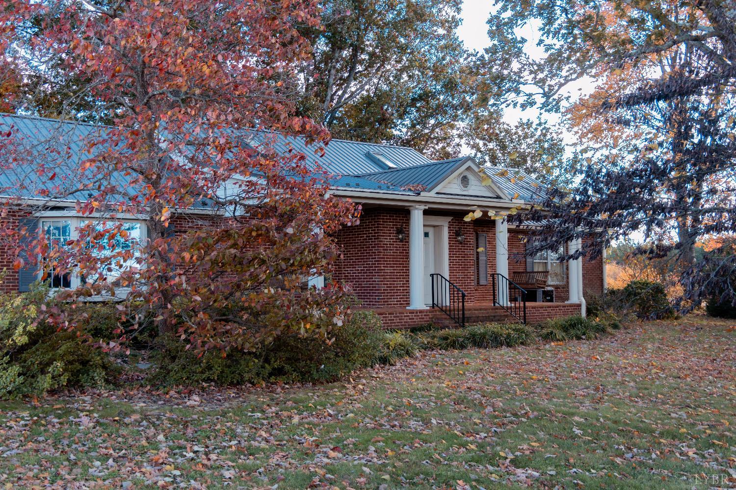7941 Sugar Hill Road Brookneal, VA 24528 - Photo 43 of 76 a front view of a house with garden
