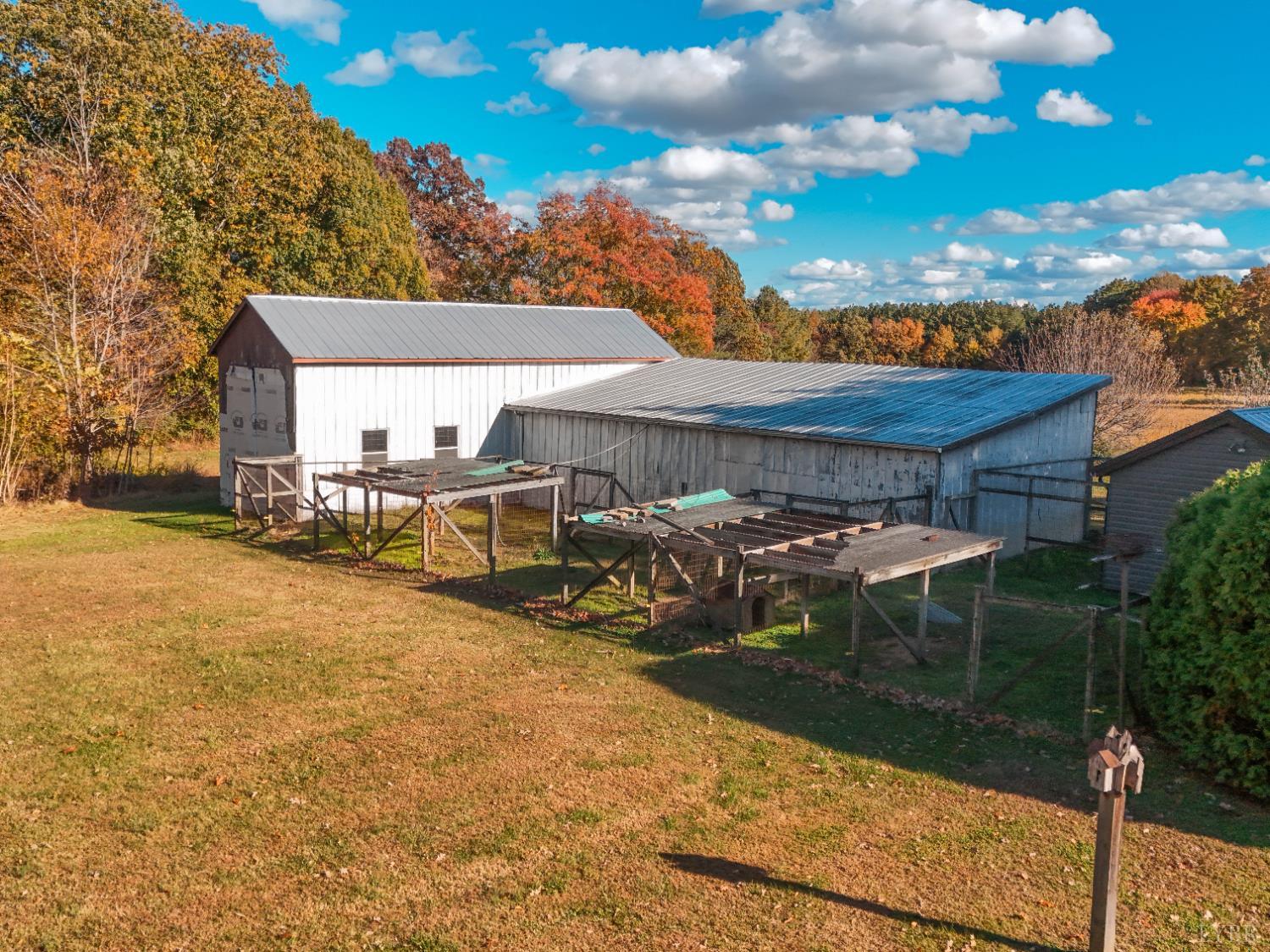 7941 Sugar Hill Road Brookneal, VA 24528 - Photo 61 of 76 a view of a patio with table and chairs with wooden fence