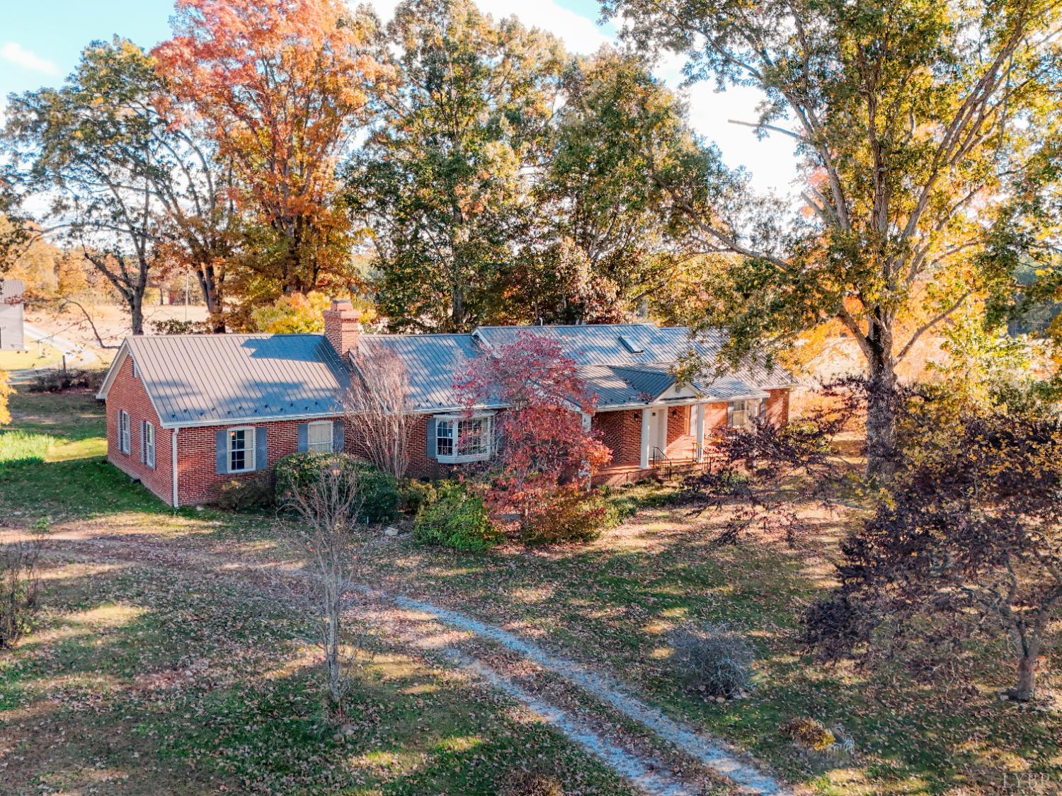 7941 Sugar Hill Road Brookneal, VA 24528 - Photo 62 of 76 a view of a house with a tree in the yard