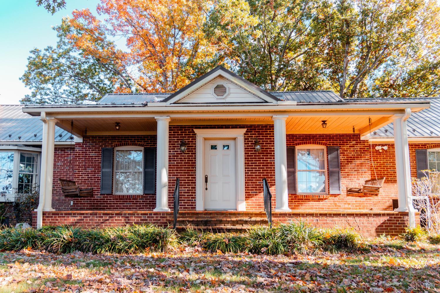 7941 Sugar Hill Road Brookneal, VA 24528 - Photo 69 of 76 a front view of a house with garden