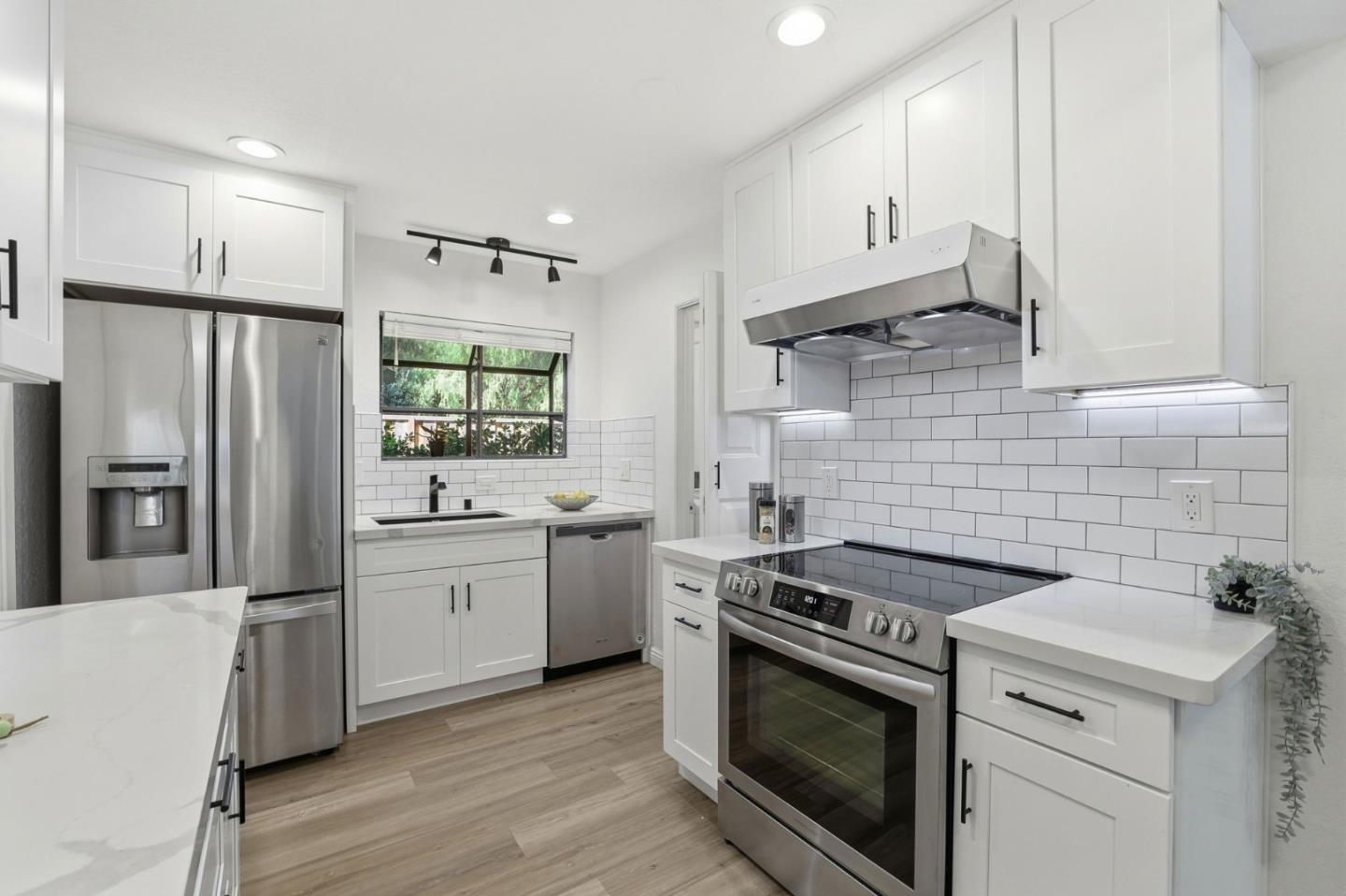 709 Winstead Court Sunnyvale, CA 94087 - Photo 17 of 21 a kitchen with stainless steel appliances a stove a sink and a refrigerator