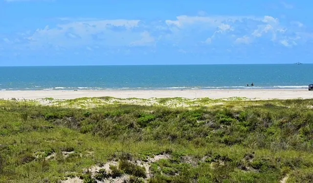 a view of ocean and mountain