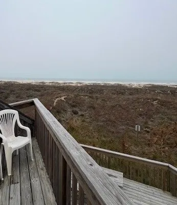 a view of balcony with furniture