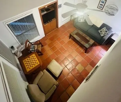 a view of living room with furniture and a window