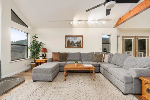 a living room with furniture and a large window