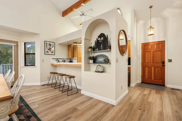 a view of dining room with furniture and wooden floor