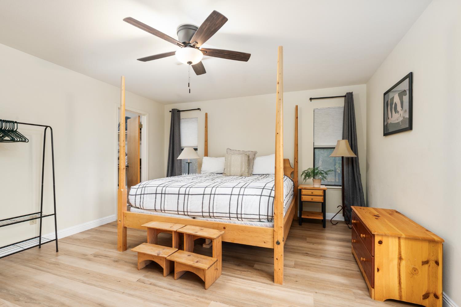 53050 Ridge Top Drive North Fork, CA 93643 - Photo 31 of 52 a bedroom with a bed and wooden floor