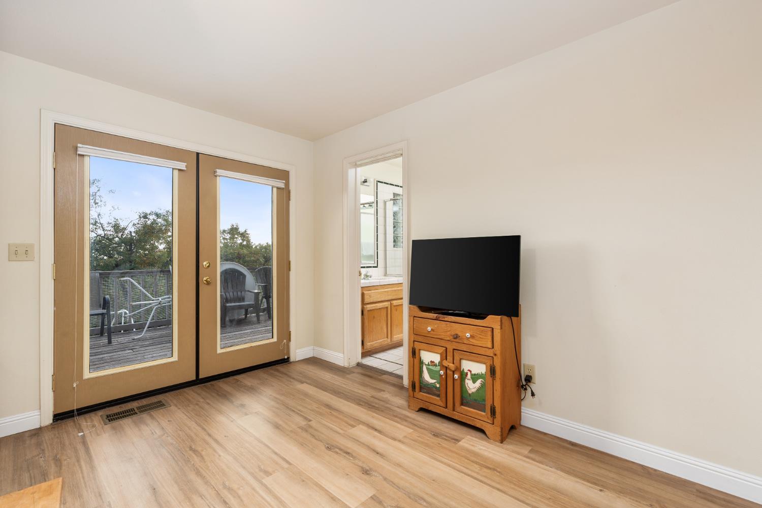 53050 Ridge Top Drive North Fork, CA 93643 - Photo 32 of 52 a living room with furniture and a flat screen tv