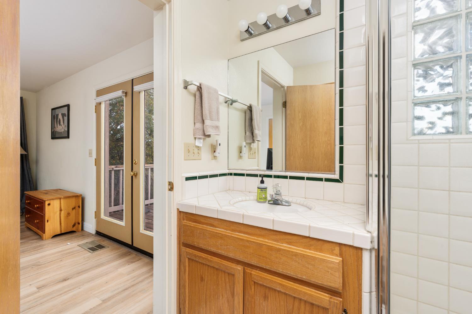 53050 Ridge Top Drive North Fork, CA 93643 - Photo 35 of 52 a bathroom with a sink and a mirror