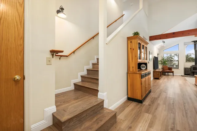 a bedroom with furniture and a wooden floor