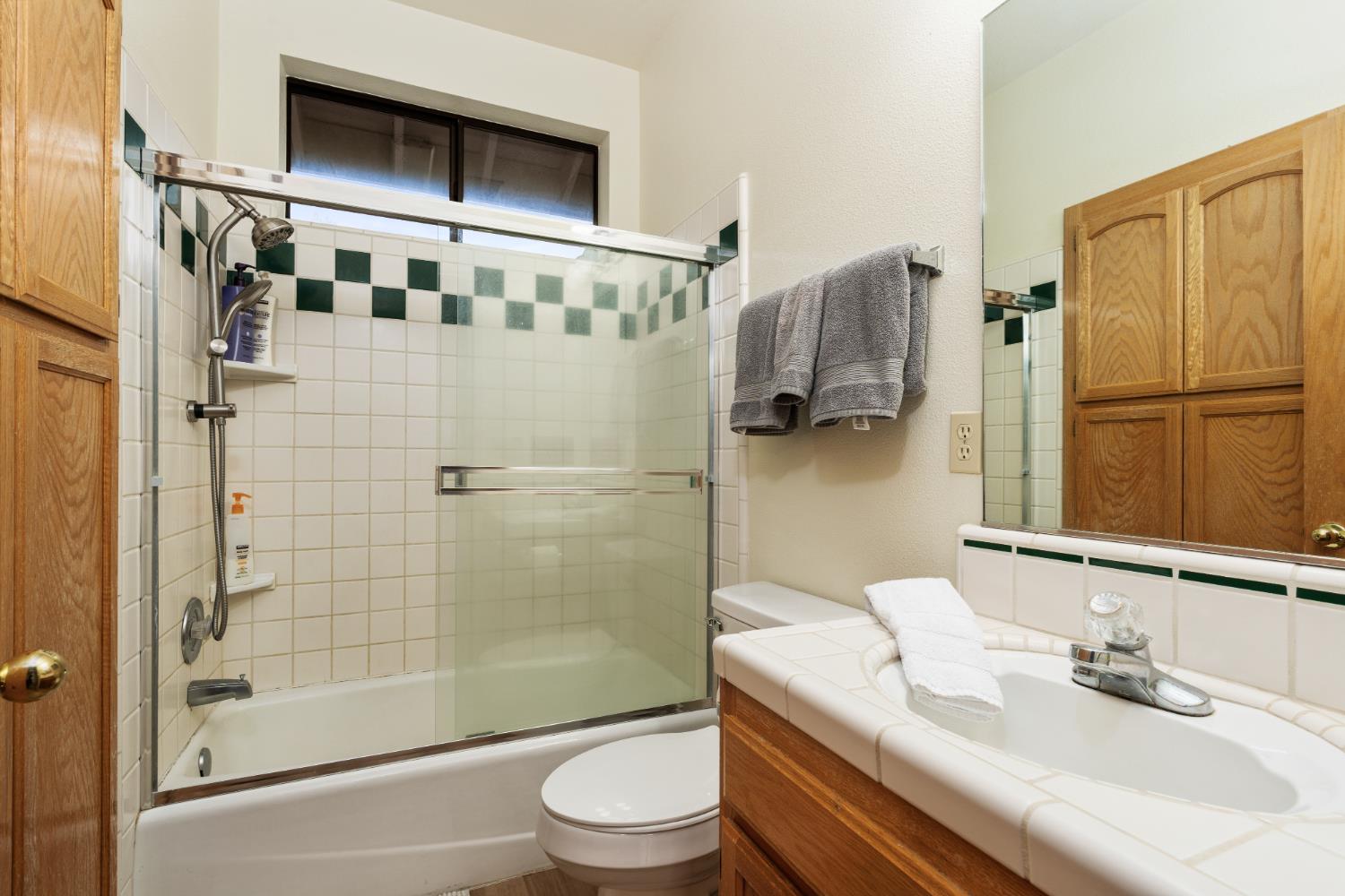 53050 Ridge Top Drive North Fork, CA 93643 - Photo 39 of 52 a bathroom with a sink toilet and shower