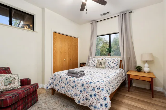 a bedroom with a bed and a window