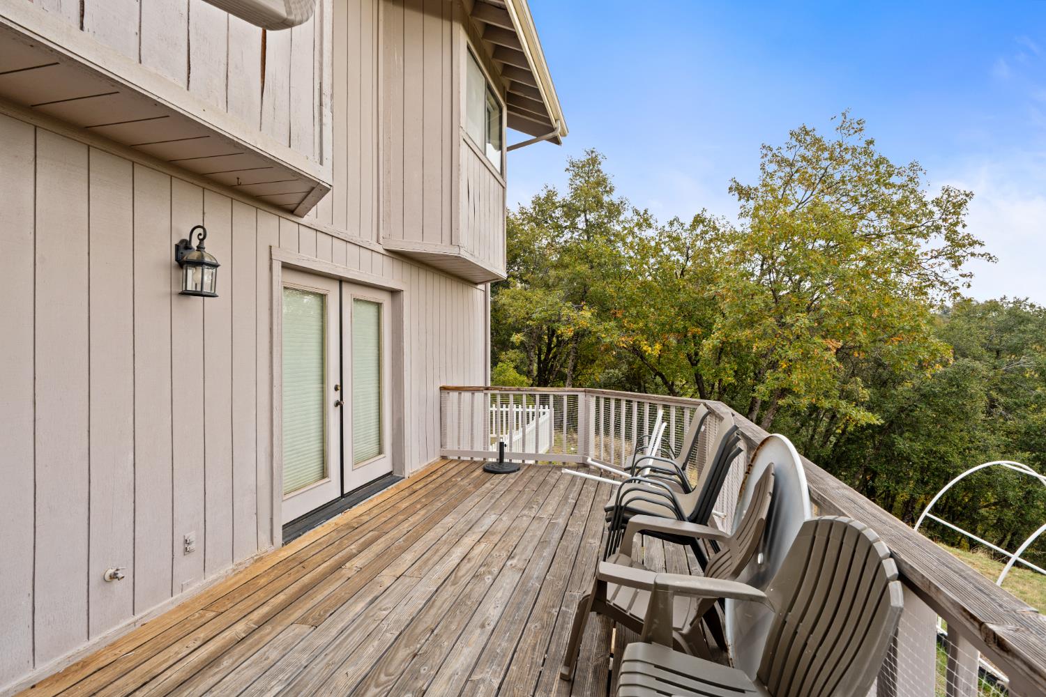 53050 Ridge Top Drive North Fork, CA 93643 - Photo 46 of 52 a view of balcony with wooden floor and outdoor seating