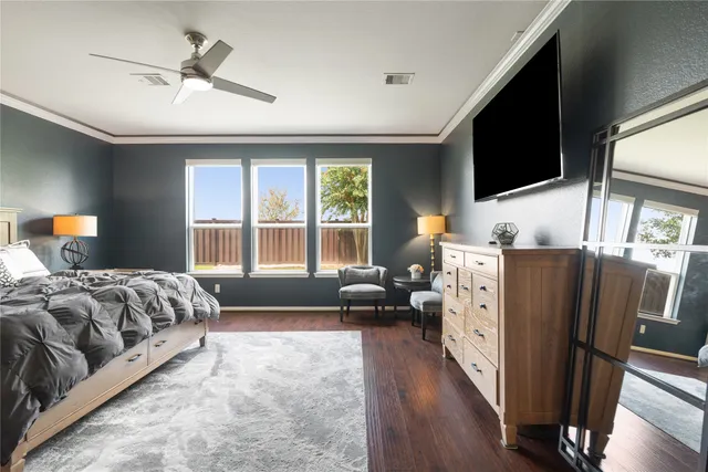 a bedroom with a bed and a couch