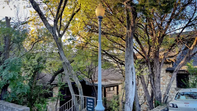 a front view of a house with trees