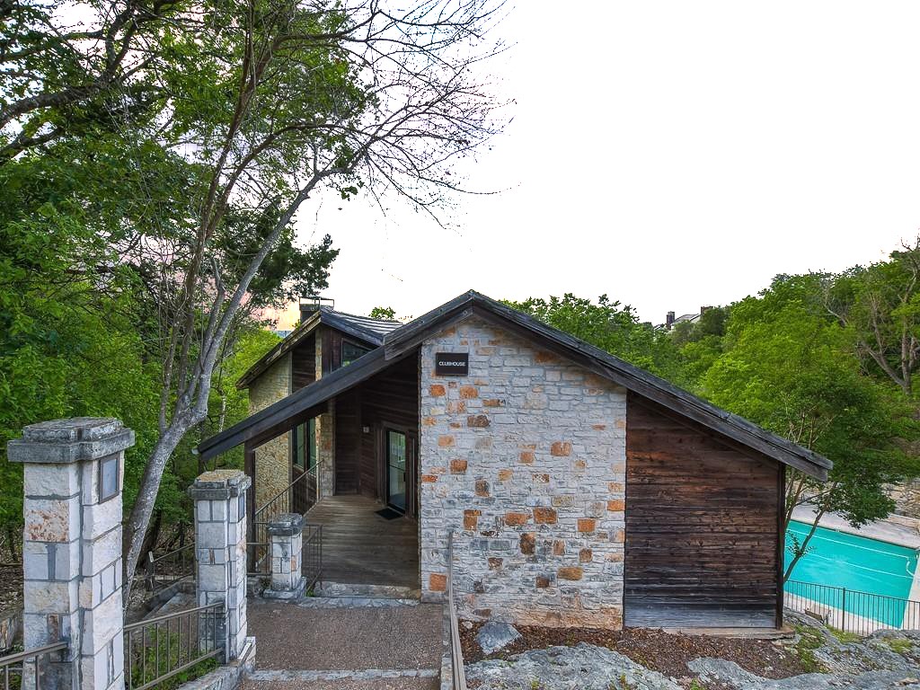 8200 Neely Drive, Unit 155 Austin, TX 78759 - Photo 15 of 17 a front view of a house with trees