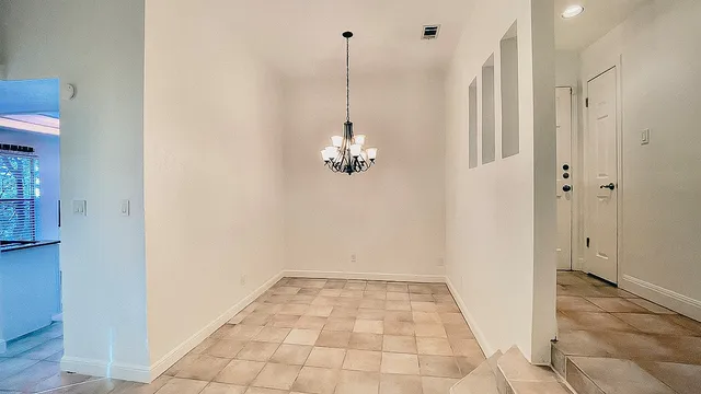an empty room with a fireplace