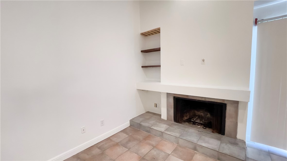 8200 Neely Drive, Unit 155 Austin, TX 78759 - Photo 7 of 17 an empty room with a fireplace