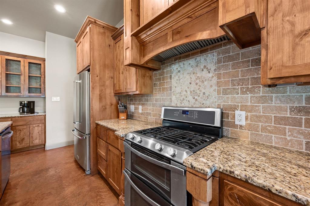 3019 Fm 718 Newark, TX 76071 - Photo 11 of 40 a kitchen with a stove and a refrigerator