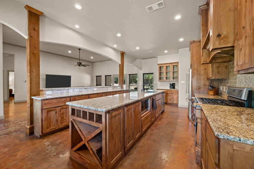 3019 Fm 718 Newark, TX 76071 - Photo 12 of 40 a large kitchen with stainless steel appliances granite countertop a large stove and a sink