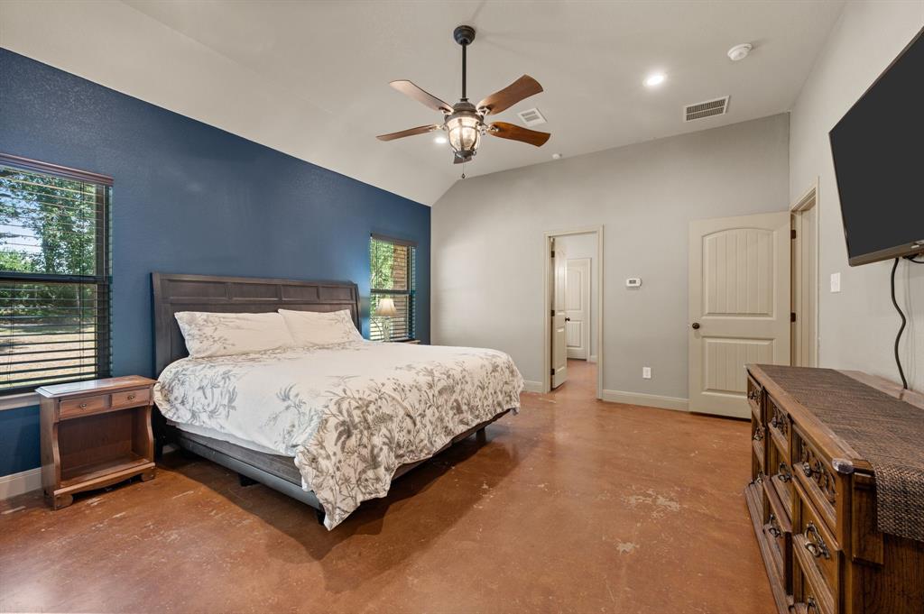 3019 Fm 718 Newark, TX 76071 - Photo 18 of 40 a spacious bedroom with a bed and a flat screen tv