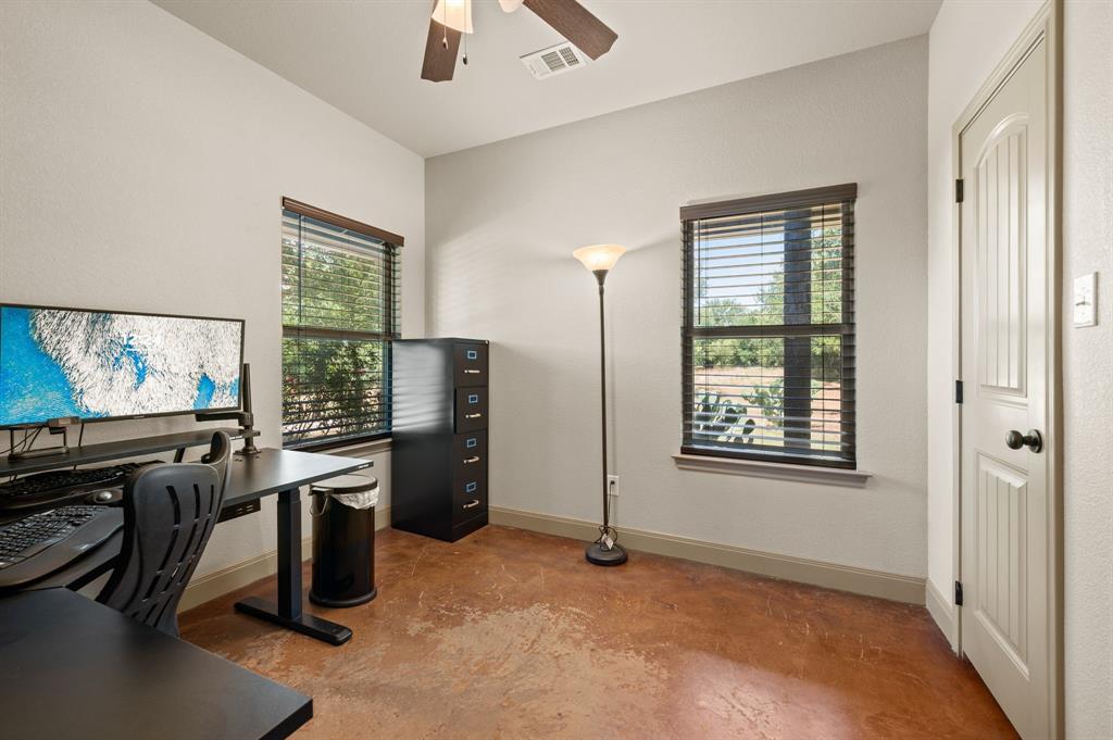 3019 Fm 718 Newark, TX 76071 - Photo 22 of 40 an empty room with windows flat screen tv and windows