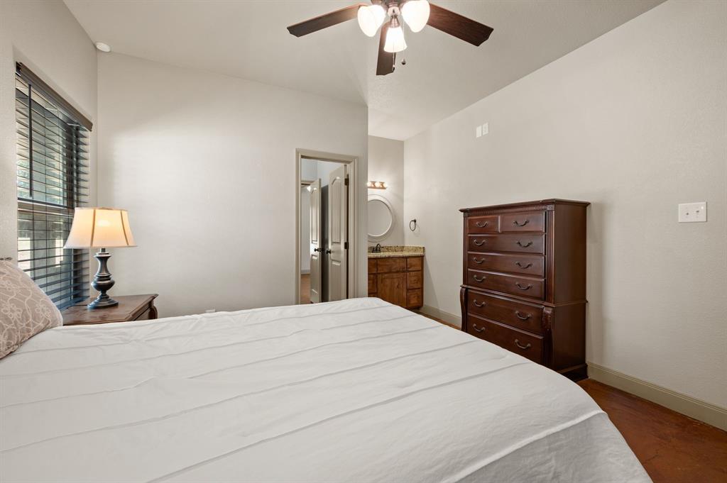 3019 Fm 718 Newark, TX 76071 - Photo 29 of 40 a bedroom with a bed and a chandelier
