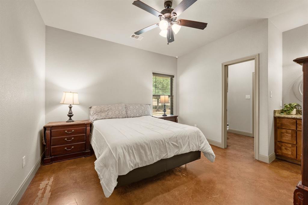 3019 Fm 718 Newark, TX 76071 - Photo 30 of 40 a bedroom with a bed and a chandelier