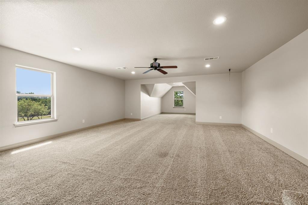 3019 Fm 718 Newark, TX 76071 - Photo 32 of 40 an empty room with a ceiling fan and window