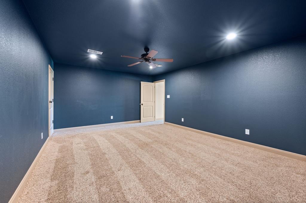 3019 Fm 718 Newark, TX 76071 - Photo 34 of 40 an empty room with a ceiling fan and window