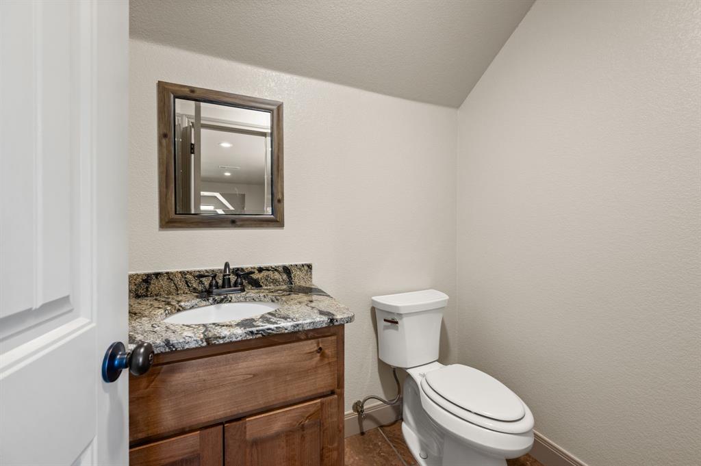 3019 Fm 718 Newark, TX 76071 - Photo 36 of 40 a white toilet sitting next to a bathroom sink